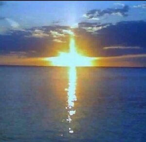 sun cross connecting the water of Lake Ontario and the sky